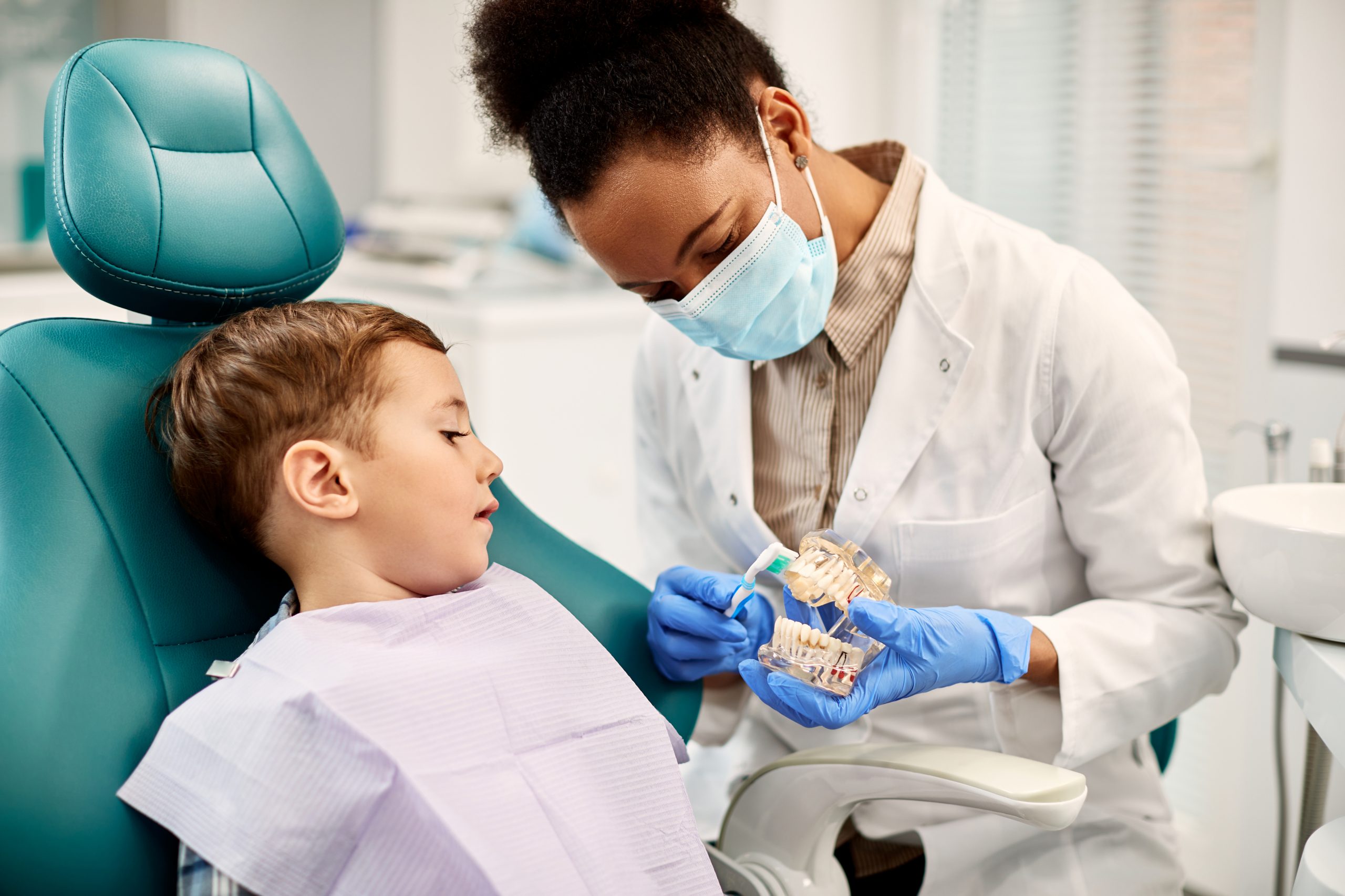 Female Dentist explaining to child